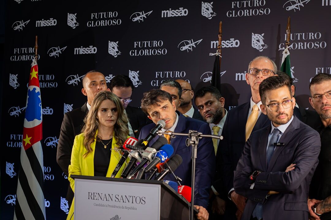 Journalists and photographers working together at a press conference